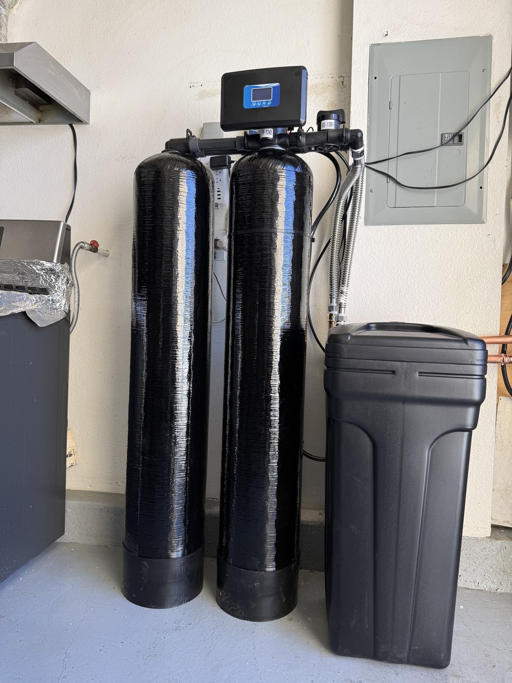 Sol Connection outdoor dual-tank water softener installation with smart valve display in Southern California